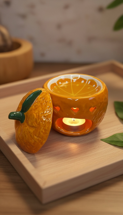 Brûleur d’huile en forme d’orange fraîchement cueillie